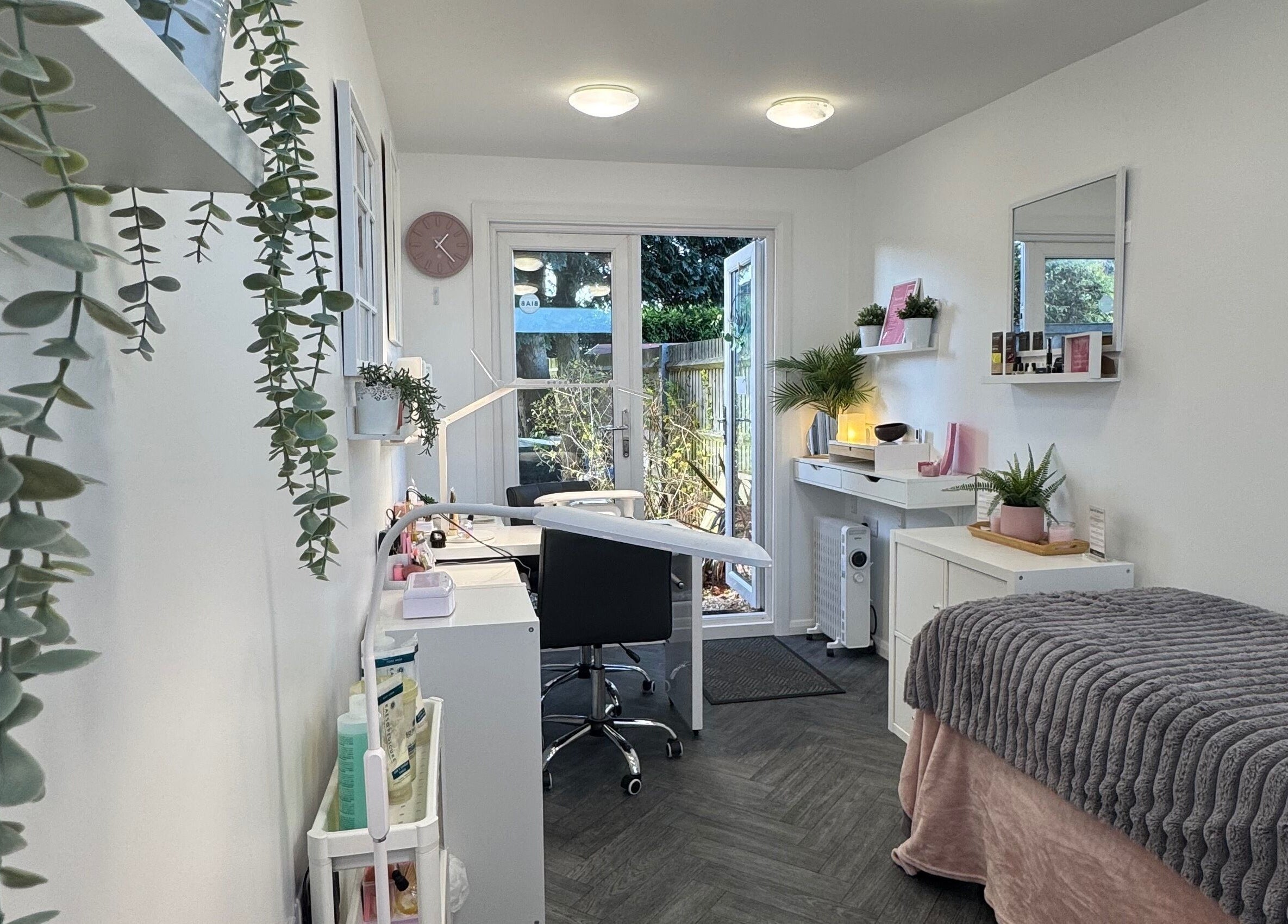 Relaxing beauty treatment room at Utopia Beauty Farnham in Farnham, England, GB with cozy decor.