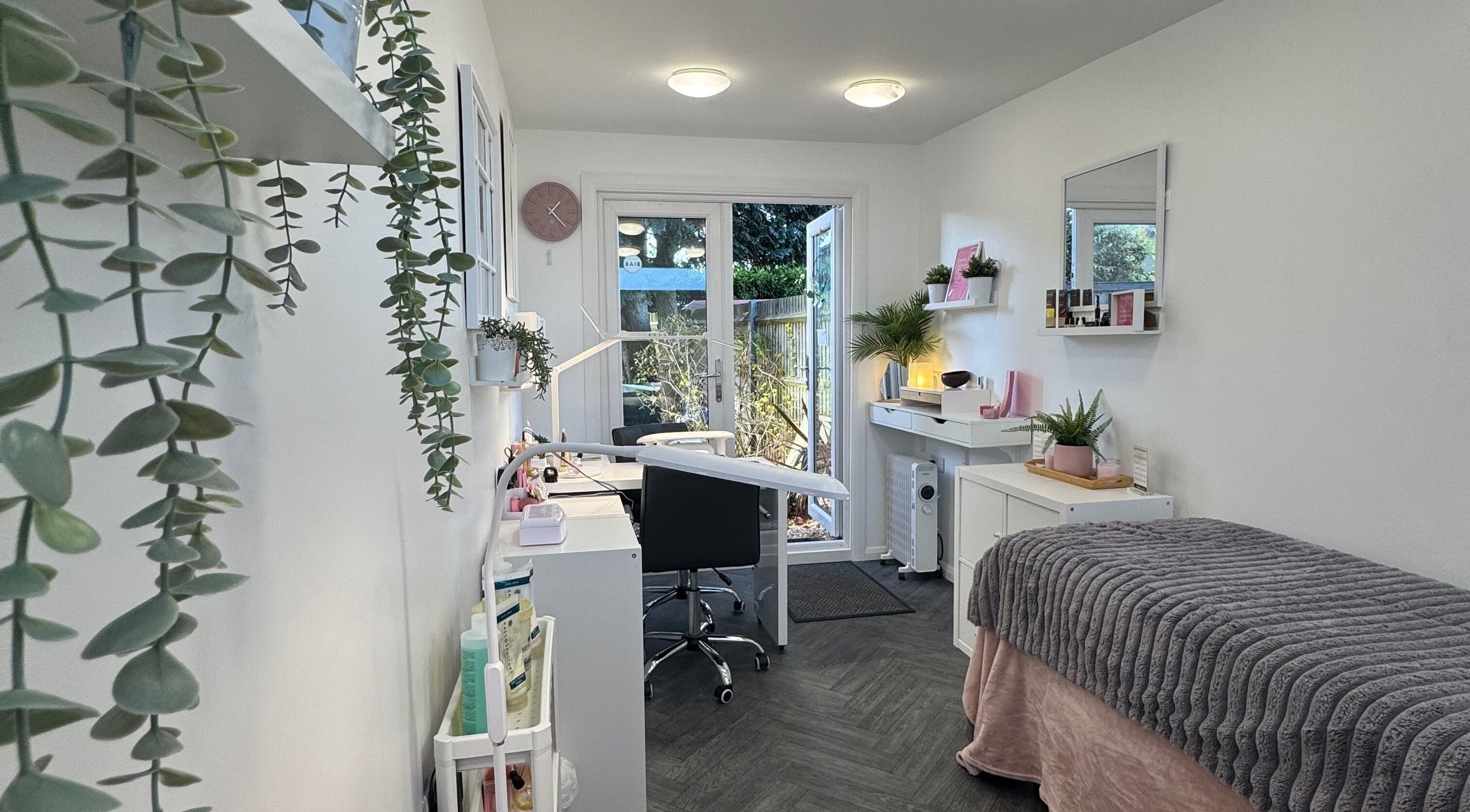 Relaxing beauty treatment room at Utopia Beauty Farnham in Farnham, England, GB with cozy decor.