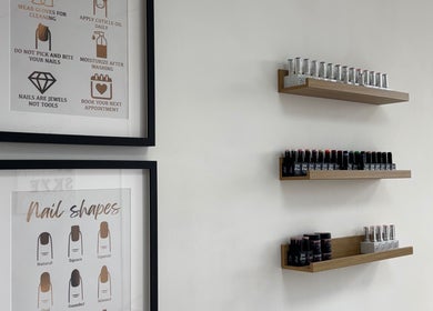 Nails by Skye wall with nail care tips and polish shelves, Paisley, Scotland, GB.