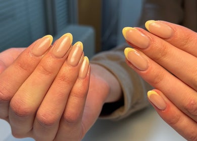 Yellow-tipped nails at Nails by Skye, Paisley, Scotland, GB, showcasing elegant manicure style.