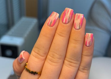 Colorful nail art at Nails by Skye, Paisley, Scotland, GB. Features pink and glitter designs.
