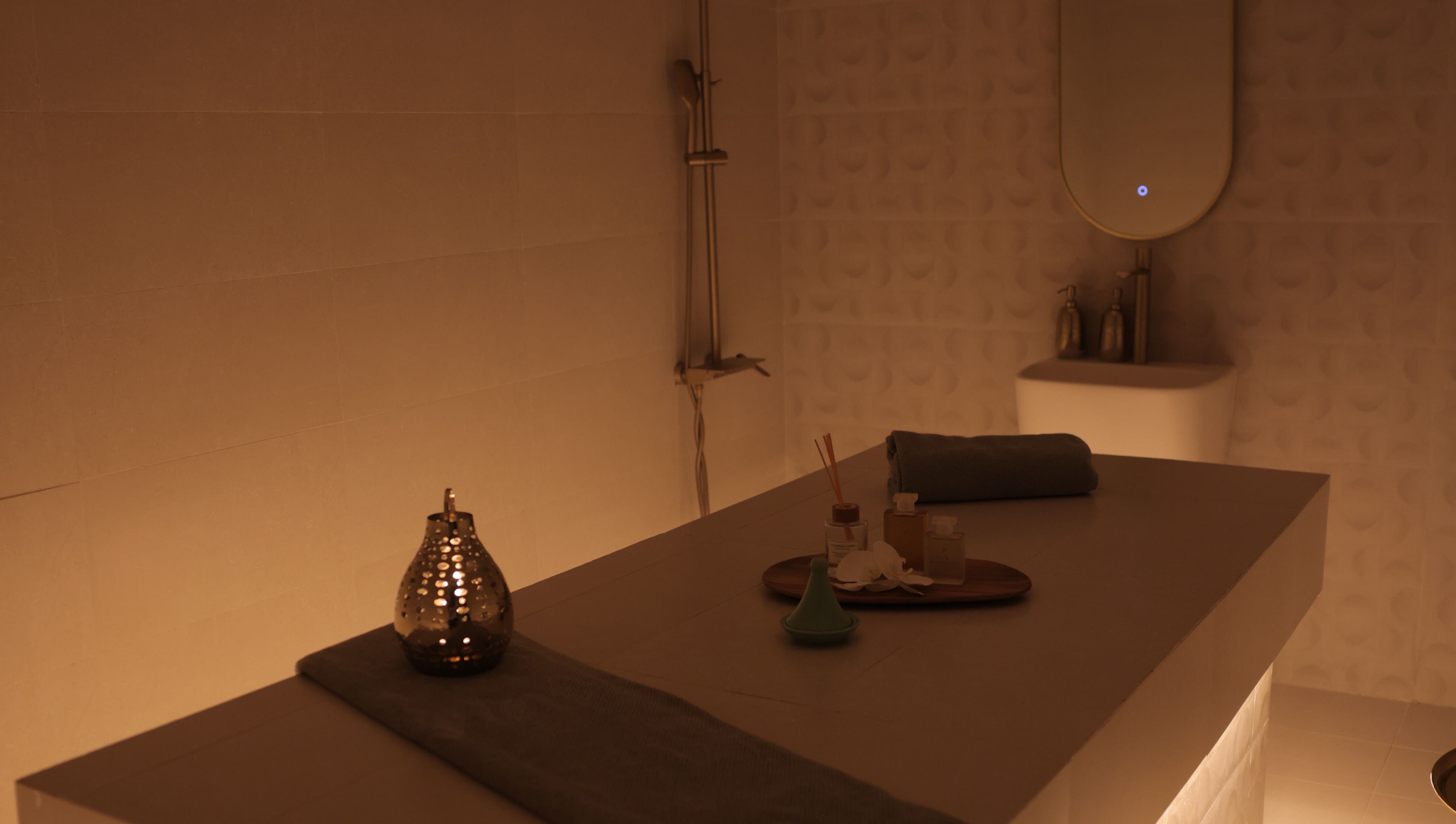 Relaxing spa room at Calm Spa, Riyadh, Riyadh Province, SA. Ambient lighting, massage table, and aromatic decor.