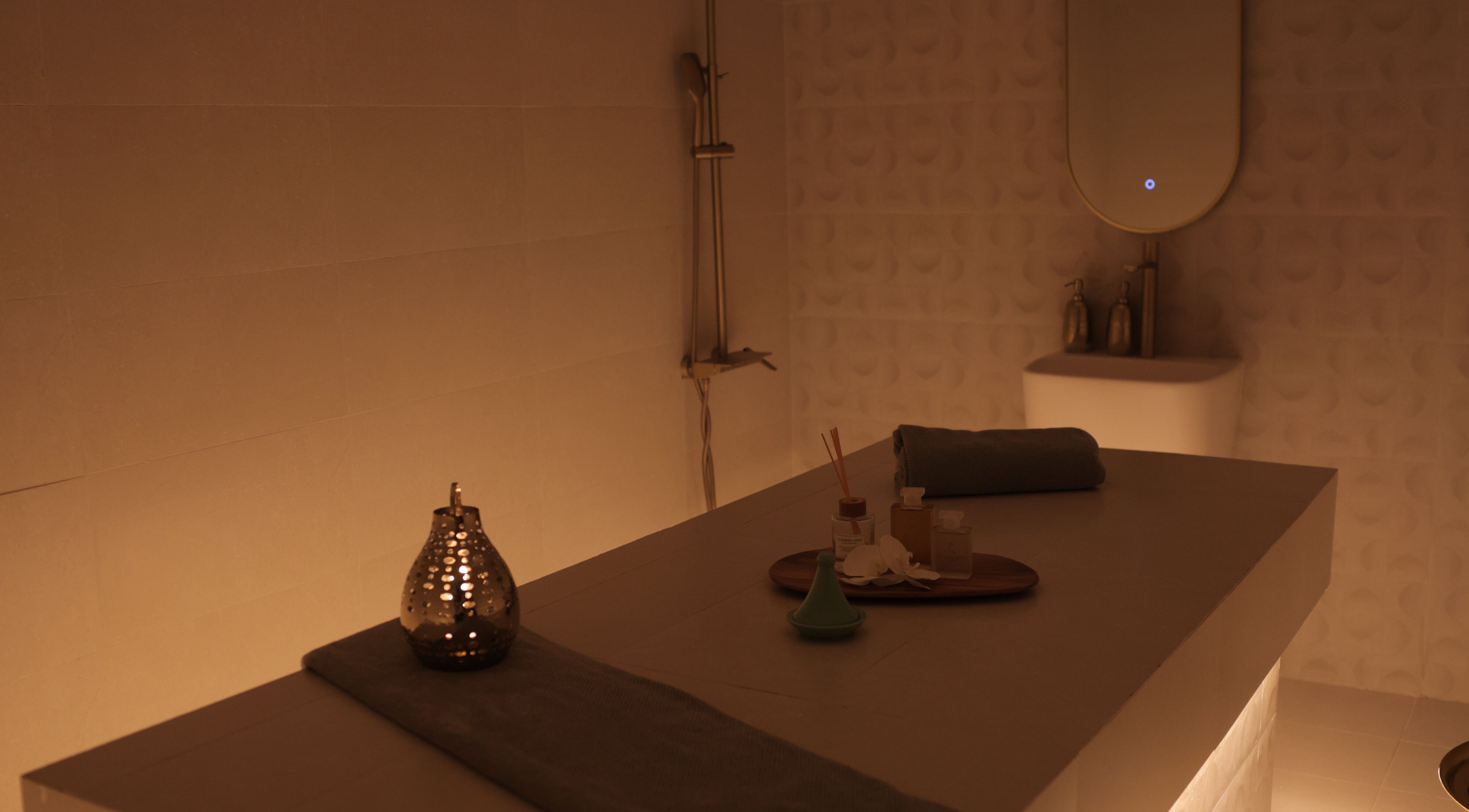 Relaxing spa room at Calm Spa, Riyadh, Riyadh Province, SA. Ambient lighting, massage table, and aromatic decor.