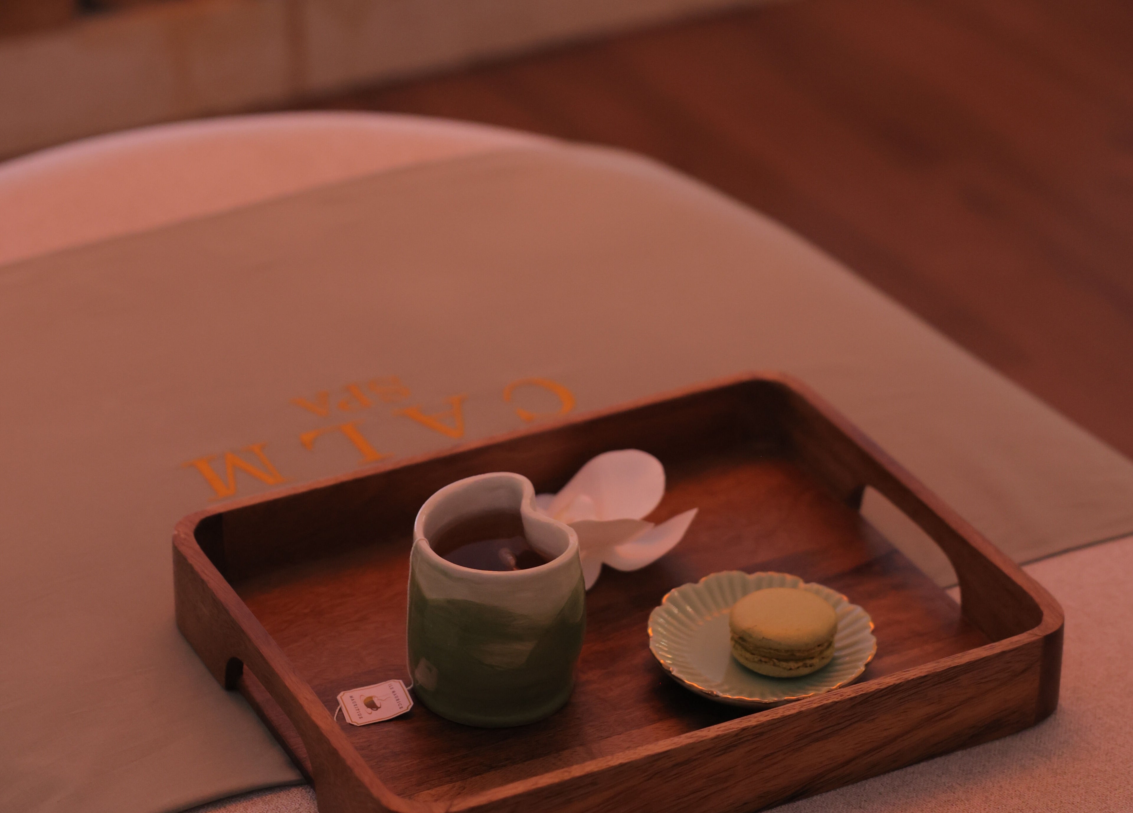 Relaxing tea and macaron on a wooden tray at Calm Spa, Riyadh, Riyadh Province, SA.