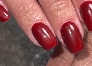 Close-up of glossy red manicure at Glitzy Nailz Fairy, Isle Of Man, Onchan, IM, showcasing premium nail art.