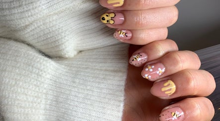 Bee-themed nail art at Nailsbysadie in Merthyr Tydfil, Wales, GB. Unique and stylish manicure design.