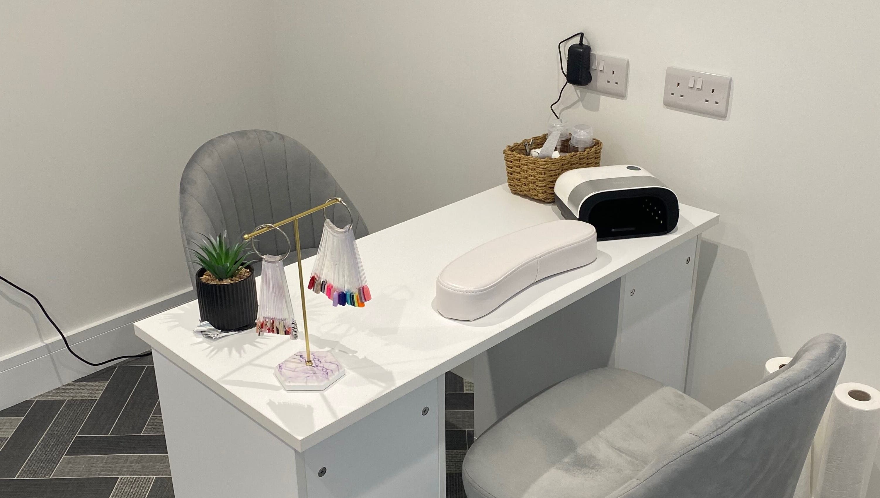 Elegant nail station at Nailsbysadie, Merthyr Tydfil, Wales, GB, featuring manicure tools and decor.