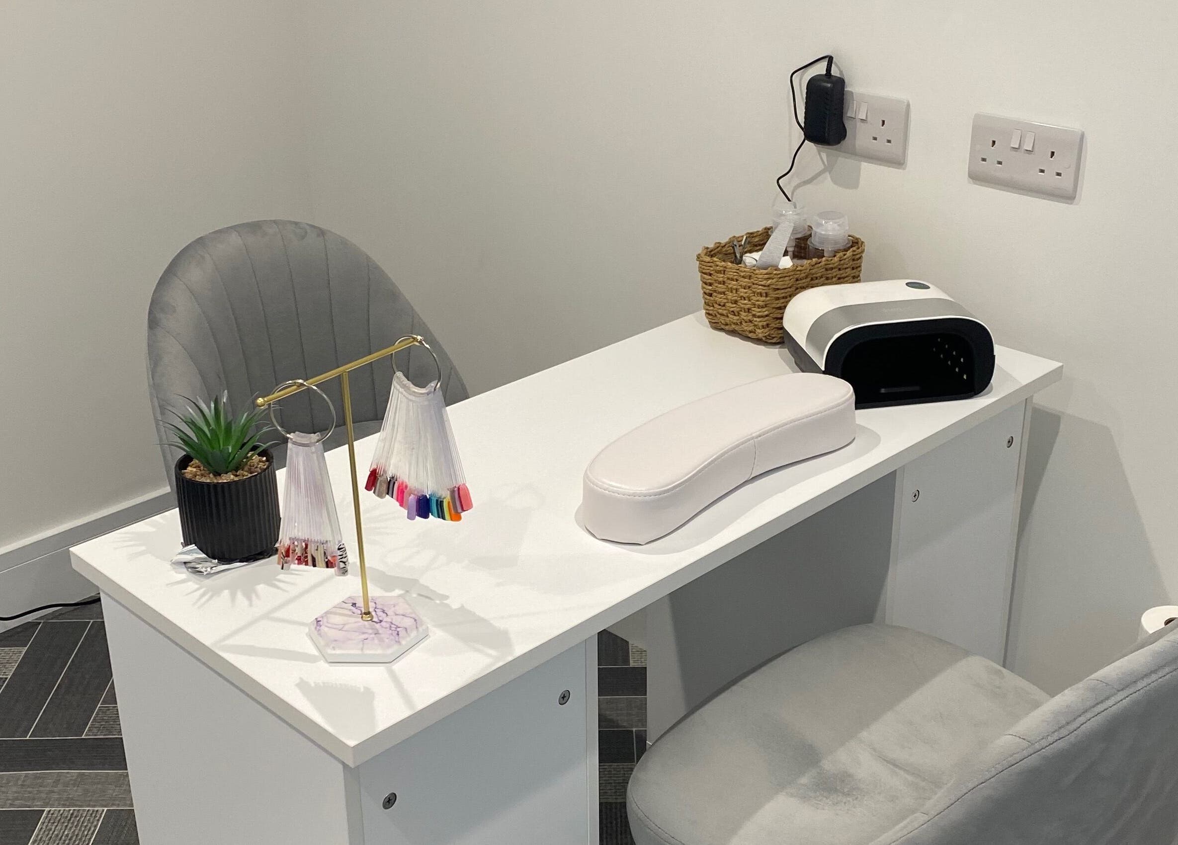 Elegant nail station at Nailsbysadie, Merthyr Tydfil, Wales, GB, featuring manicure tools and decor.