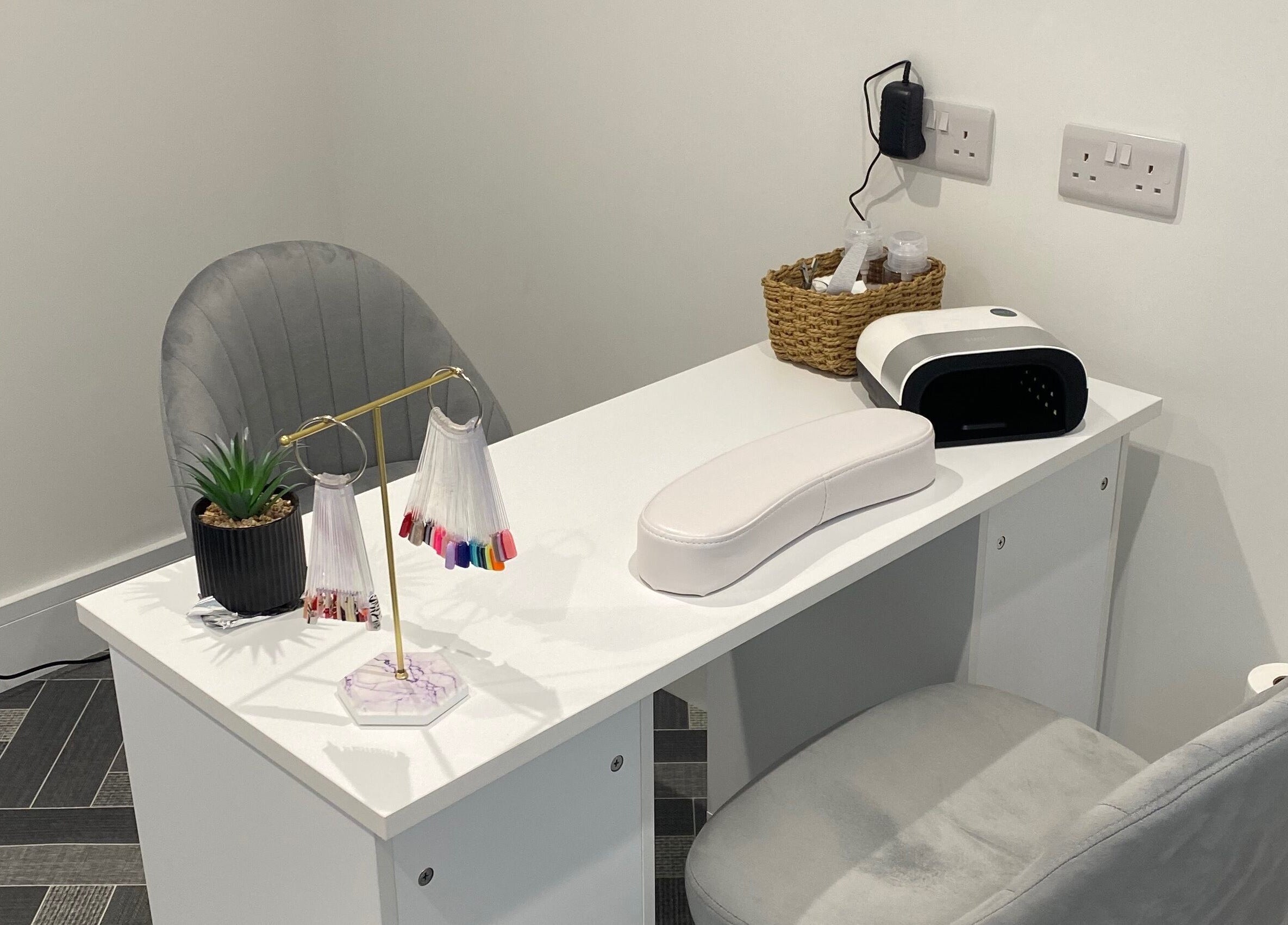 Elegant nail station at Nailsbysadie, Merthyr Tydfil, Wales, GB, featuring manicure tools and decor.