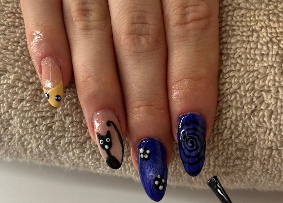 Artistic cat-themed manicure by Nailsbysadie in Merthyr Tydfil, Wales, GB. Perfect for unique nail art lovers.