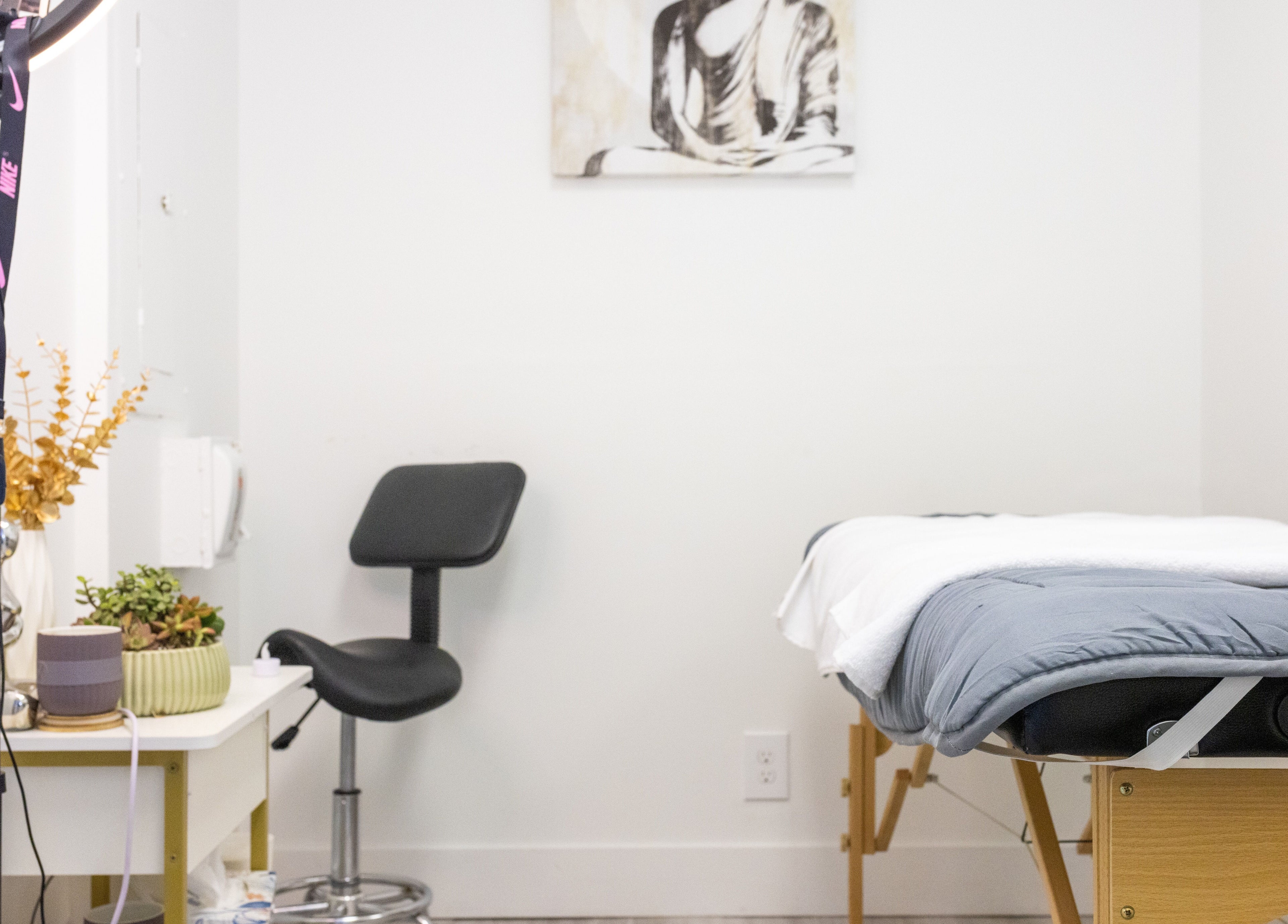 Yb Professional Downtown LA massage room in Los Angeles, California, US, featuring a treatment bed and decor.