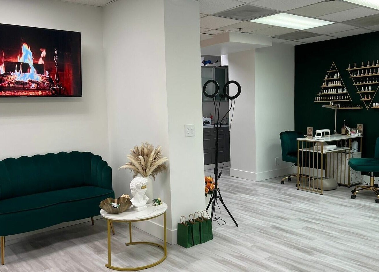 Elegant lounge at Yb Professional Marina Del Rey in Los Angeles, California, US with green seating and decor.