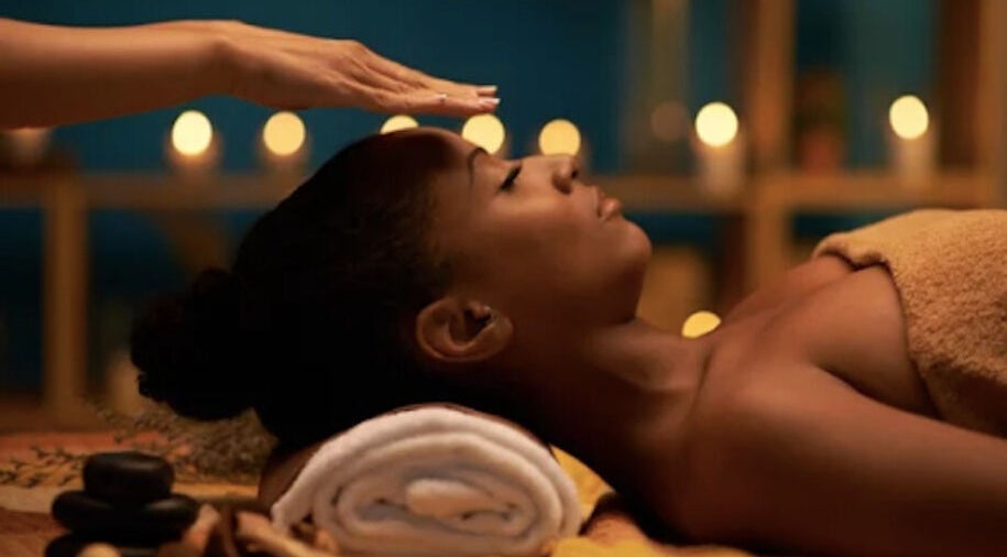 Reiki session at Lotus Holistics in Bristol, England, GB, with candles and relaxation.