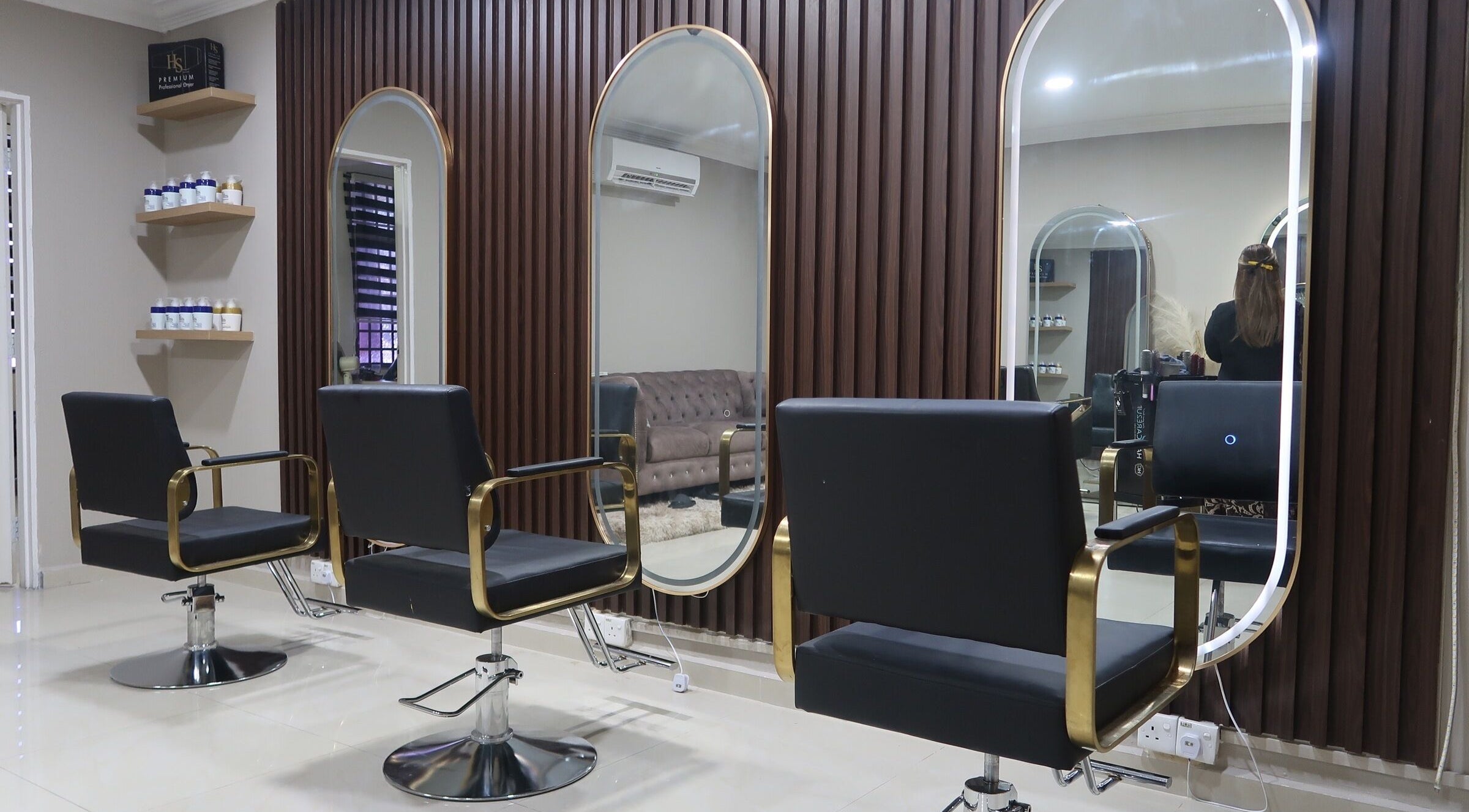 Elegant interior of ALYSSA BEAUTY SALON in Seremban, Negeri Sembilan, MY, featuring modern styling chairs and mirrors.