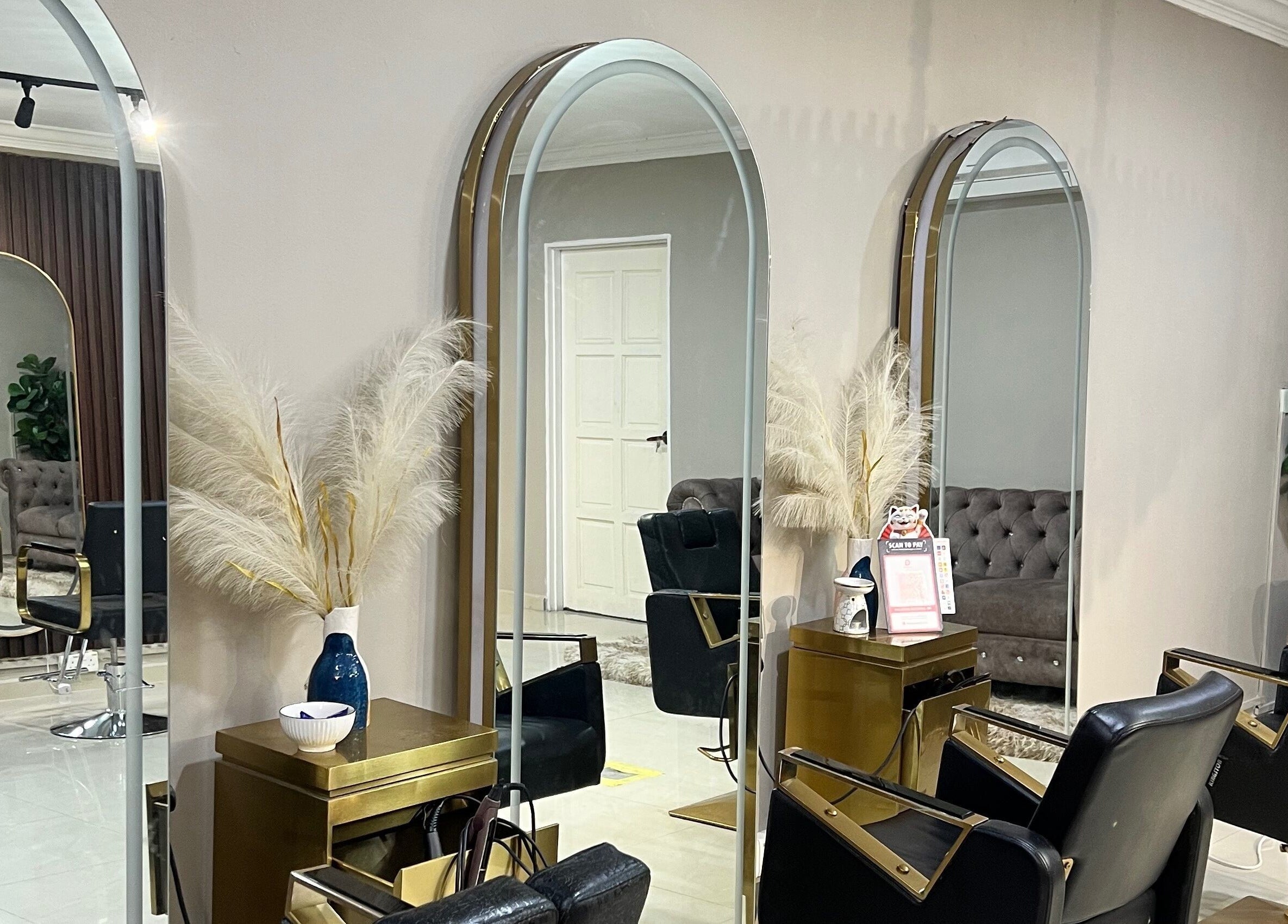 Interior of ALYSSA BEAUTY SALON, Seremban, Negeri Sembilan, MY, showcasing chic mirrors and stylish seating.