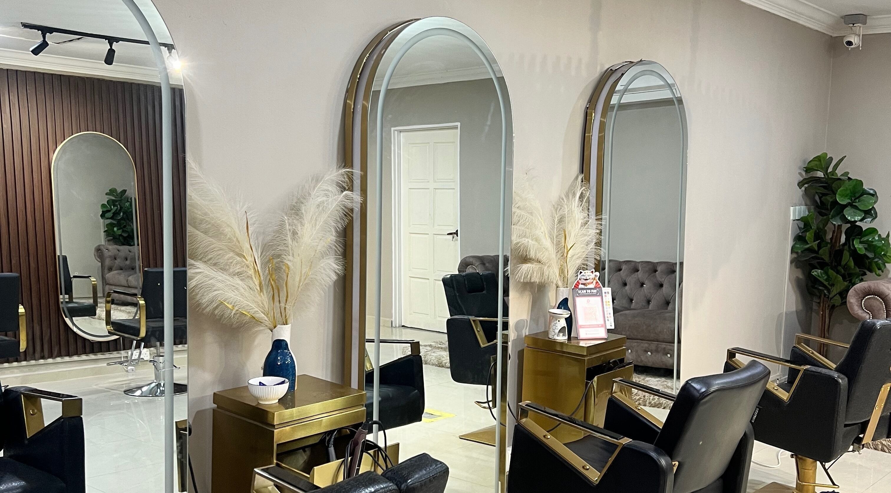 Interior of ALYSSA BEAUTY SALON, Seremban, Negeri Sembilan, MY, showcasing chic mirrors and stylish seating.