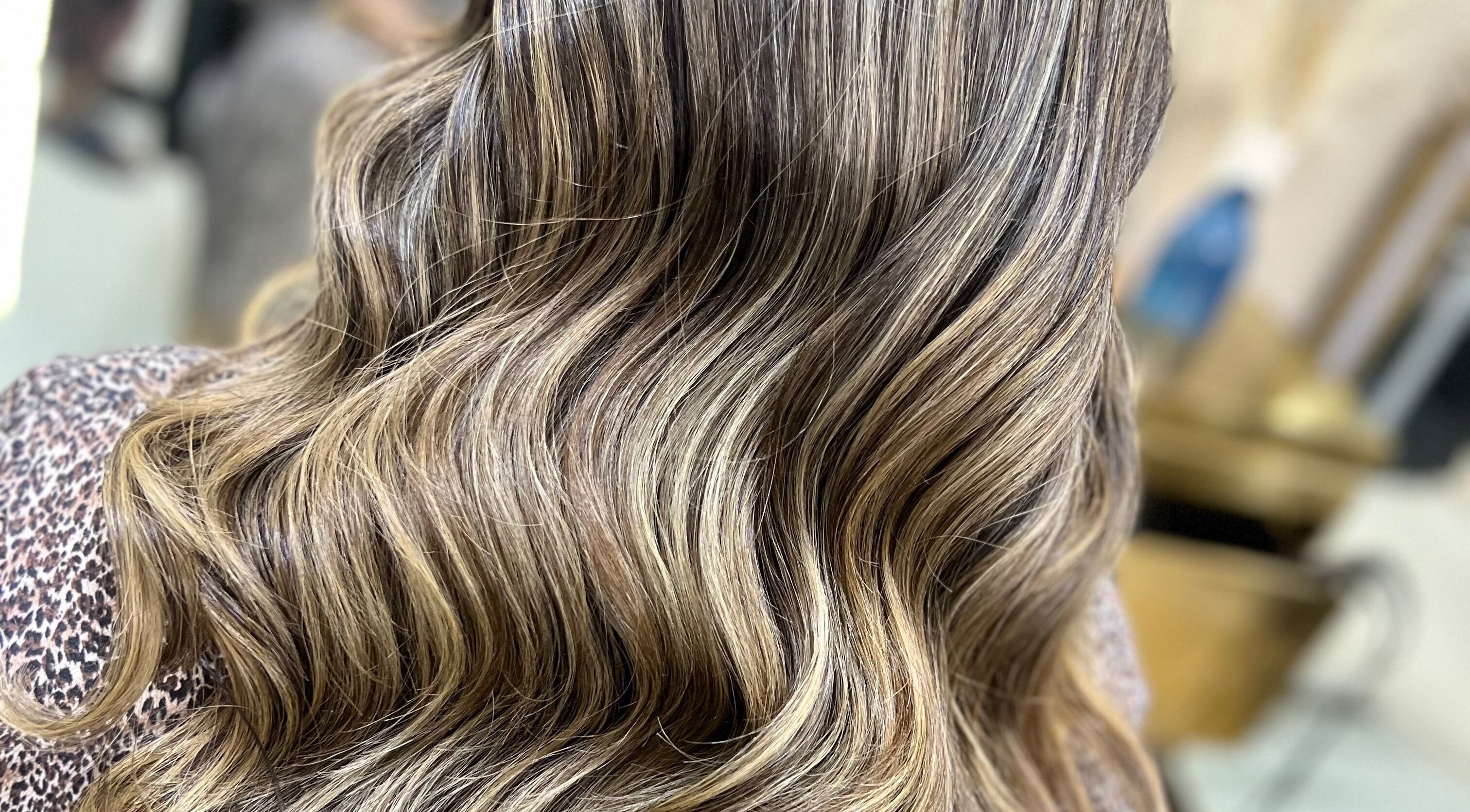 Elegant wavy hair styled at ALYSSA BEAUTY SALON, Seremban, Negeri Sembilan, MY, showcasing soft highlights.