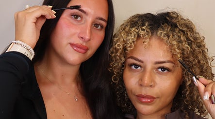 Two women showcasing expertly shaped brows at BROWZD, Birmingham, England, GB.