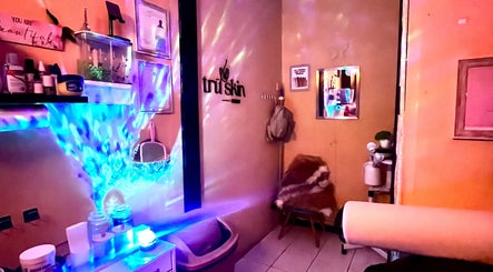 Serene interior at Trū Skin Studio, Lucea, Hanover Parish, JM, featuring soft lighting and wellness decor.