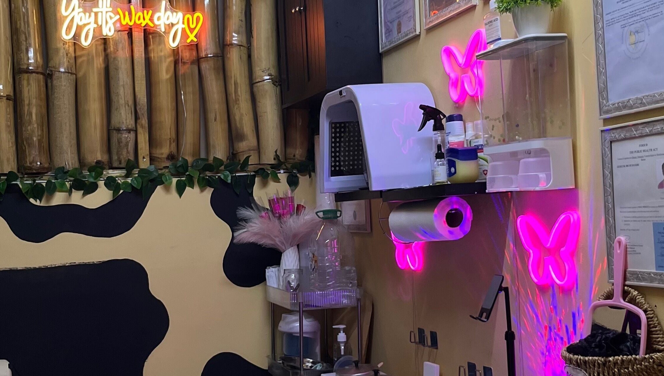 Cozy beauty room at Tru Skin Studio, Lucea, Hanover Parish, JM, featuring neon lights and bamboo decor.