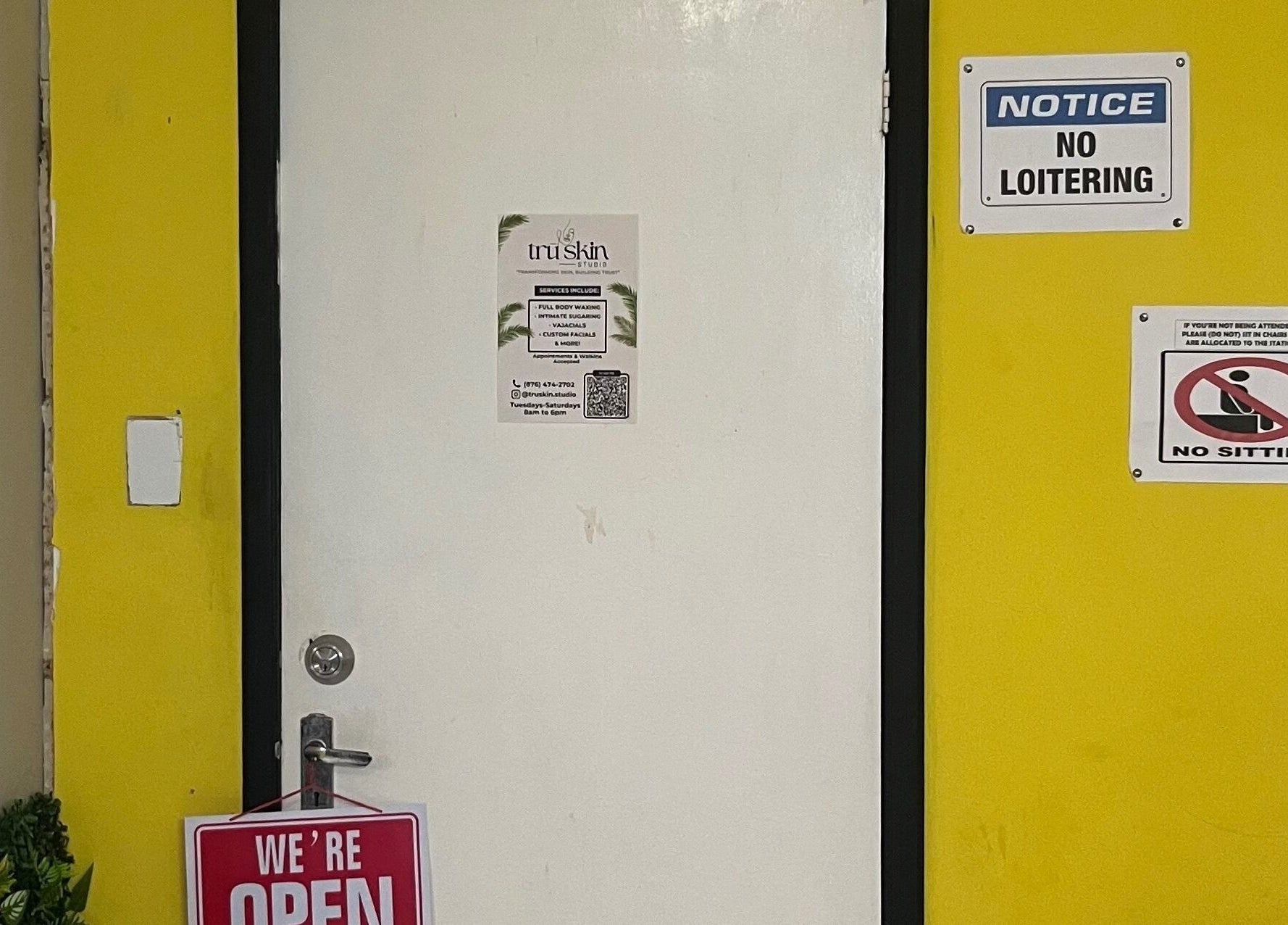 Entrance to Tru Skin Studio in Lucea, Hanover Parish, JM, featuring a welcoming open sign.