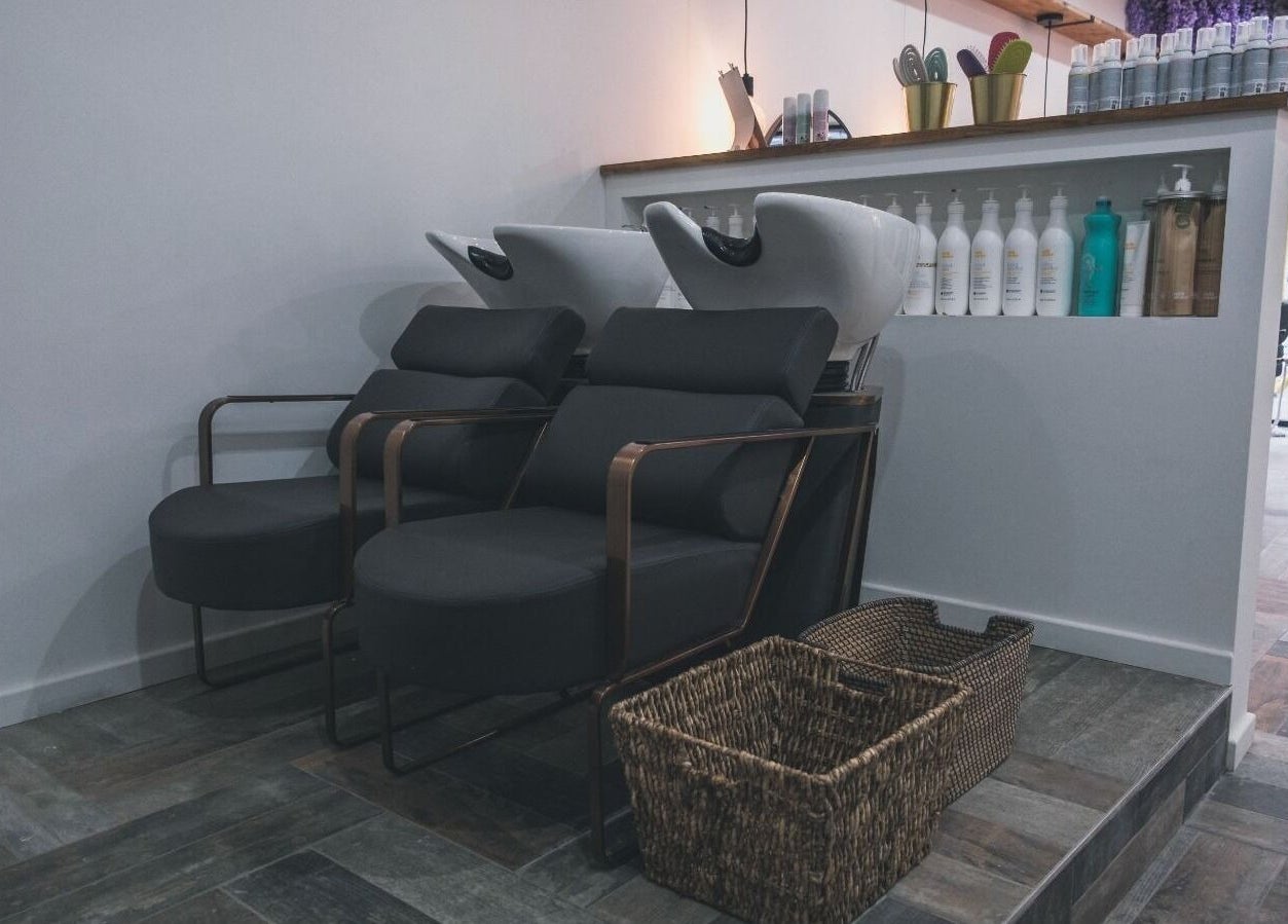 Hair washing stations at Hayden Hair Studio in Bletchley, England, GB offering modern comfort and style.