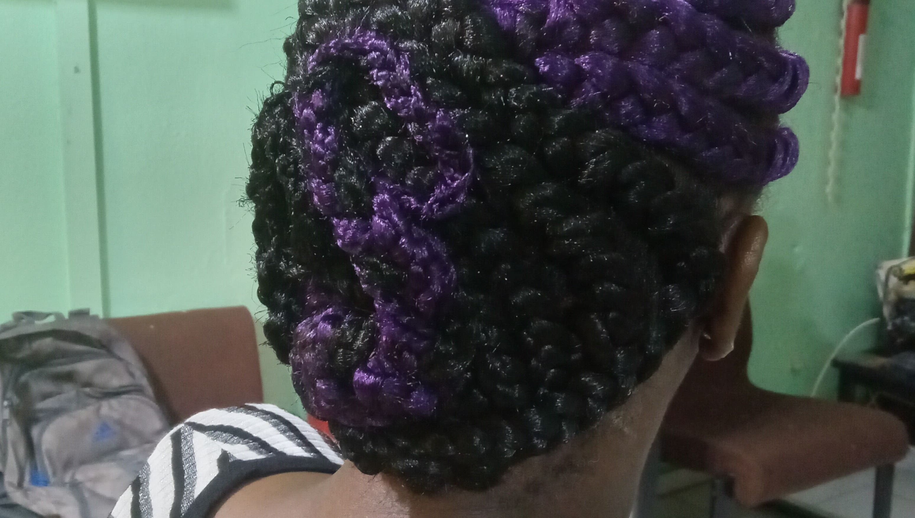 Purple and black elegant braided hairstyle at Origins Natural Beauty, Nassau, New Providence, BS.