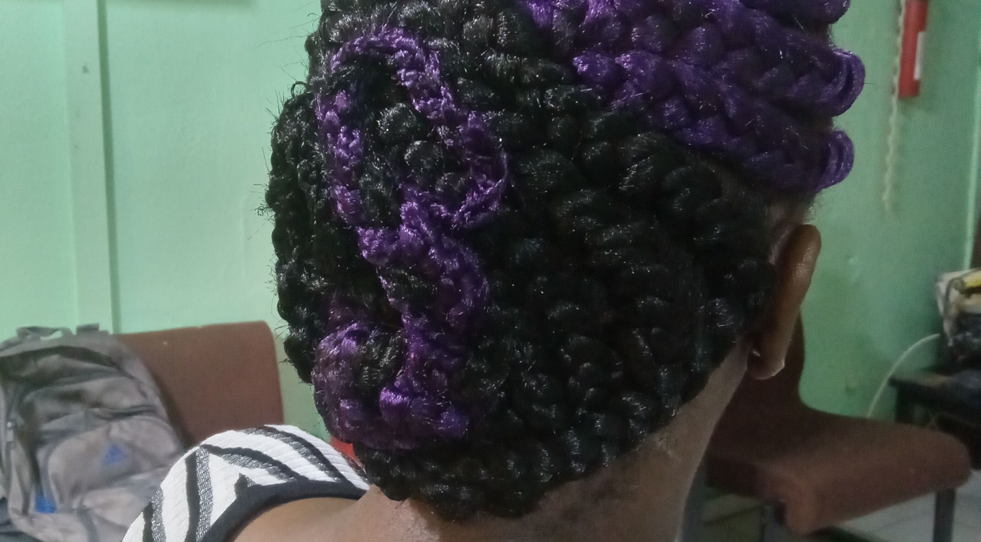 Purple and black elegant braided hairstyle at Origins Natural Beauty, Nassau, New Providence, BS.