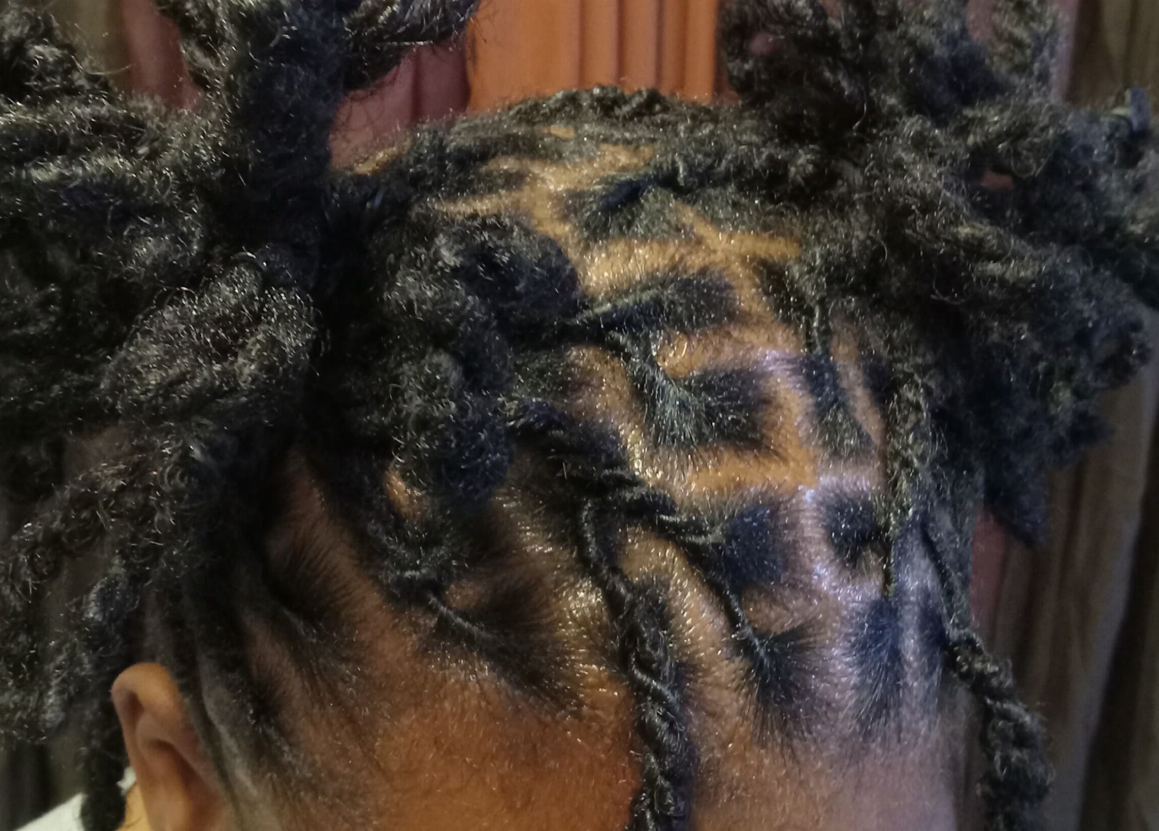 Intricate hair twists at Origins Natural Beauty, Nassau, New Providence, BS showcasing expert styling.