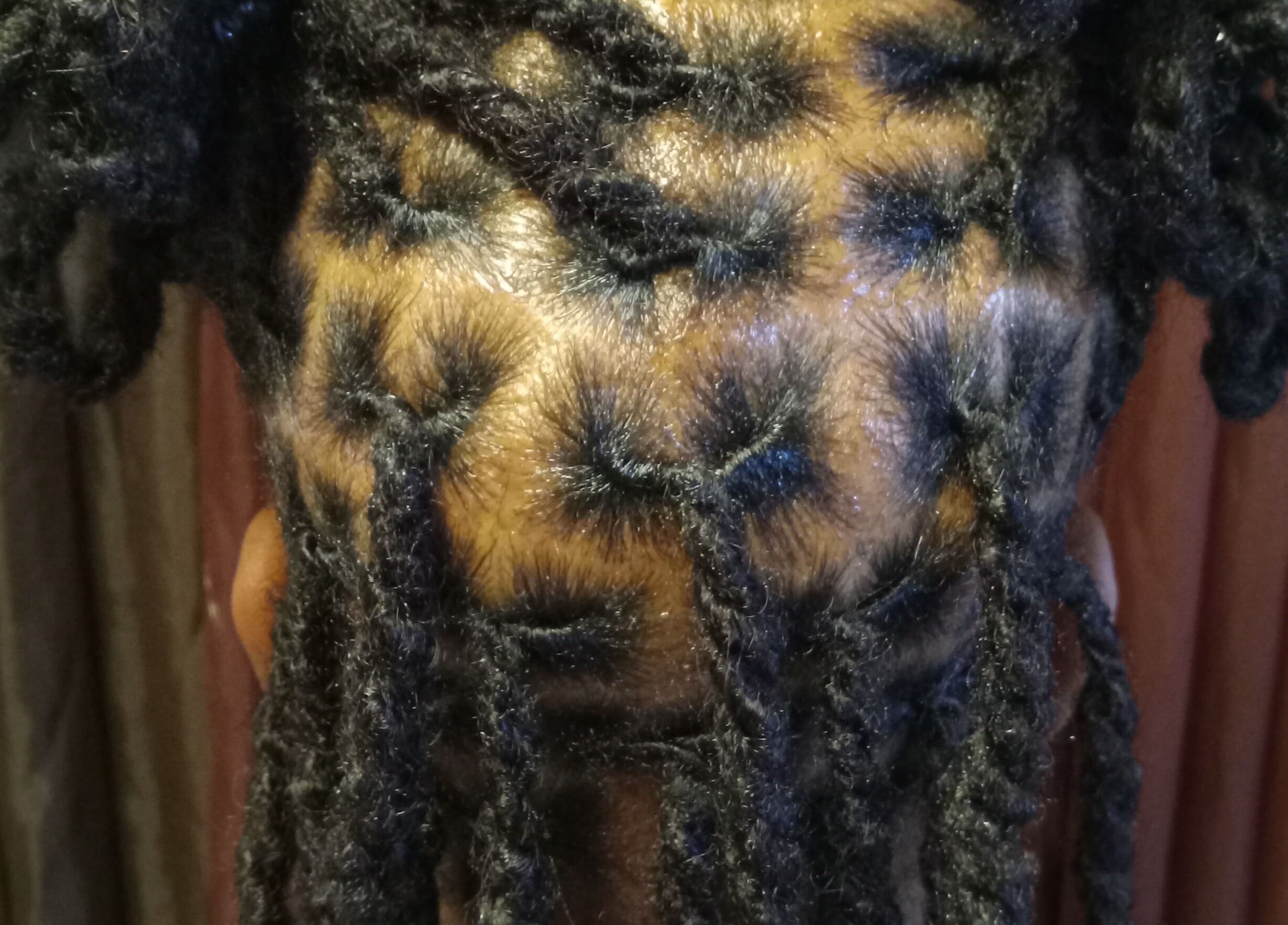 Detailed braiding style at Origins Natural Beauty in Nassau, New Providence, BS.