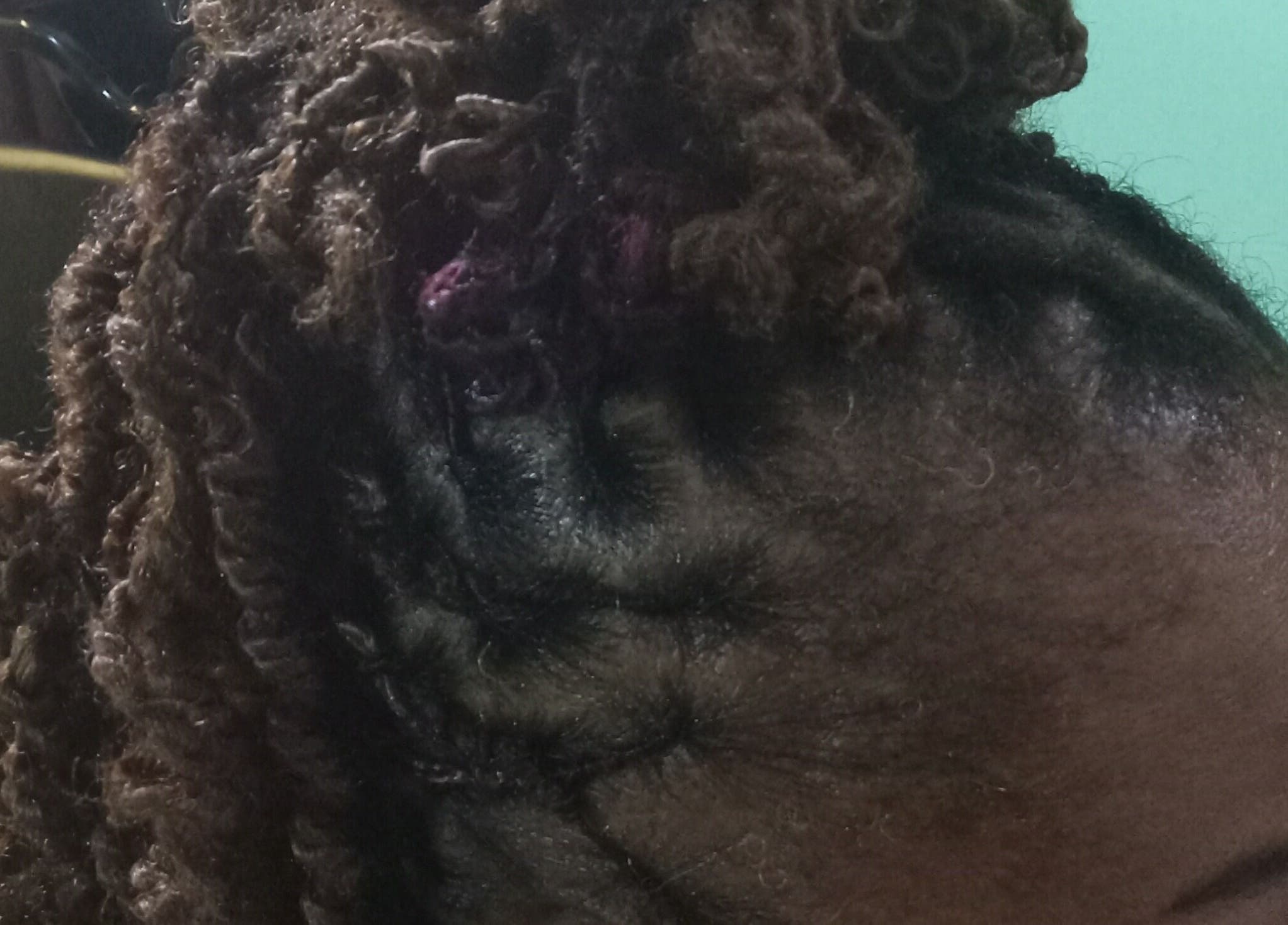 Elegant twisted hairstyle at Origins Natural Beauty in Nassau, New Providence, BS.