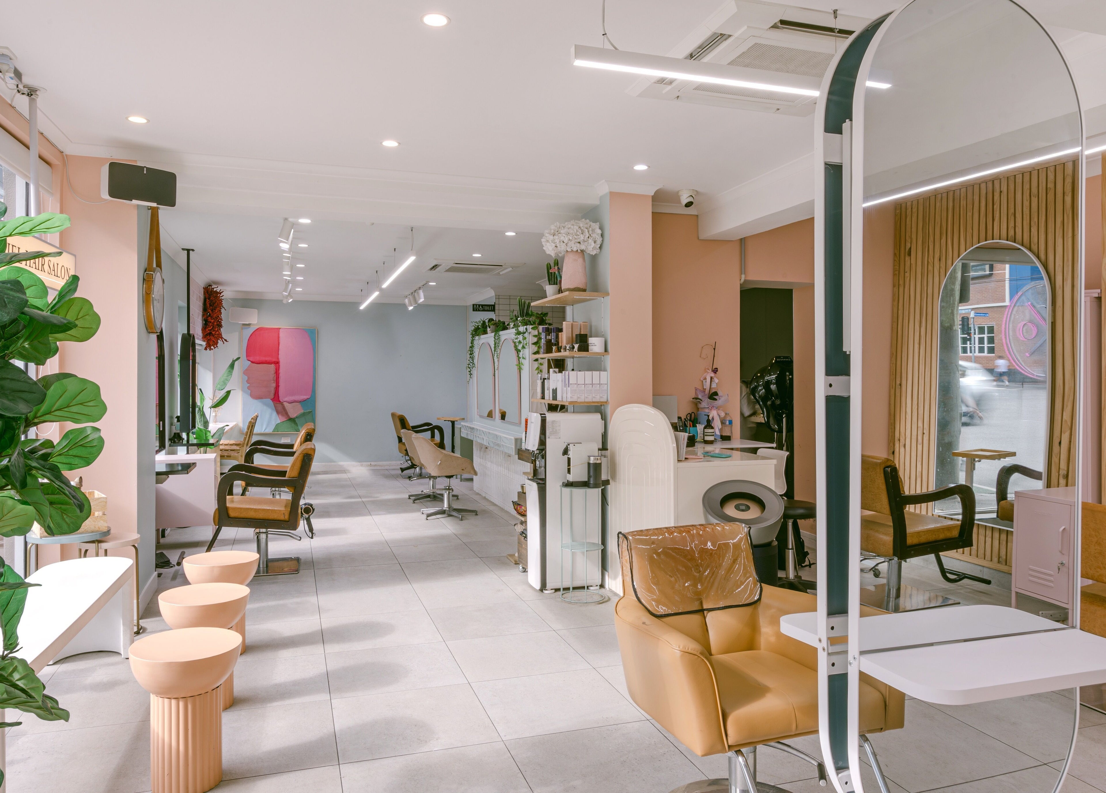 Elegant interior of Le Ciel Salon in Carlton, Victoria, AU showcasing modern chairs and stylish decor.