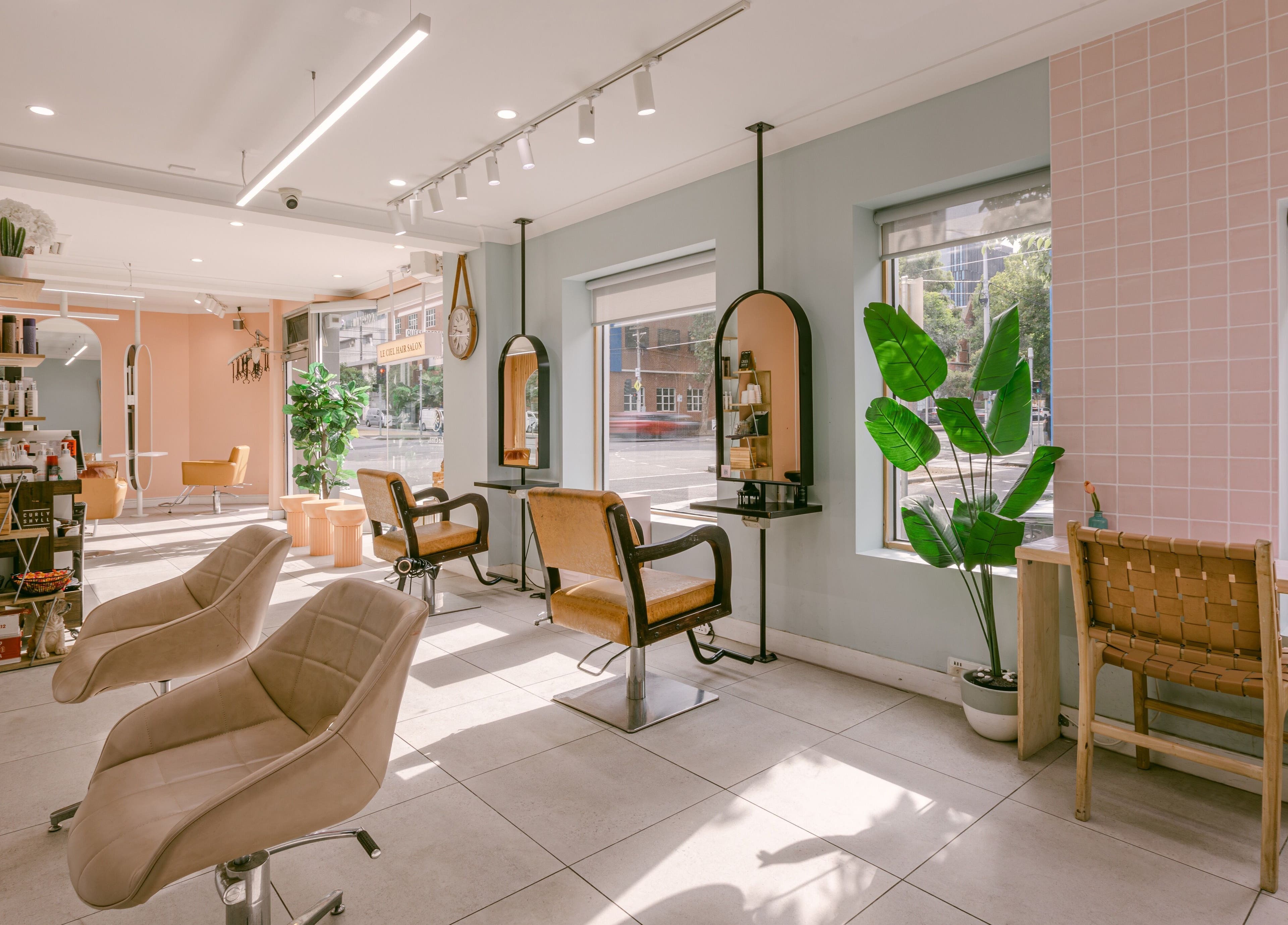 Modern interior of Le Ciel Salon, Carlton, Victoria, AU with sleek chairs and natural light.