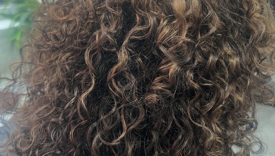 Close-up of beautifully styled curls at The Curl Gurl in Bolton, England, GB.