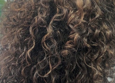 Close-up of beautifully styled curls at The Curl Gurl in Bolton, England, GB.