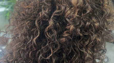 Close-up of beautifully styled curls at The Curl Gurl in Bolton, England, GB.