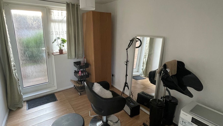 Cozy beauty workspace at Nine did Mine, London, England, GB. Features styling chair and mirror.