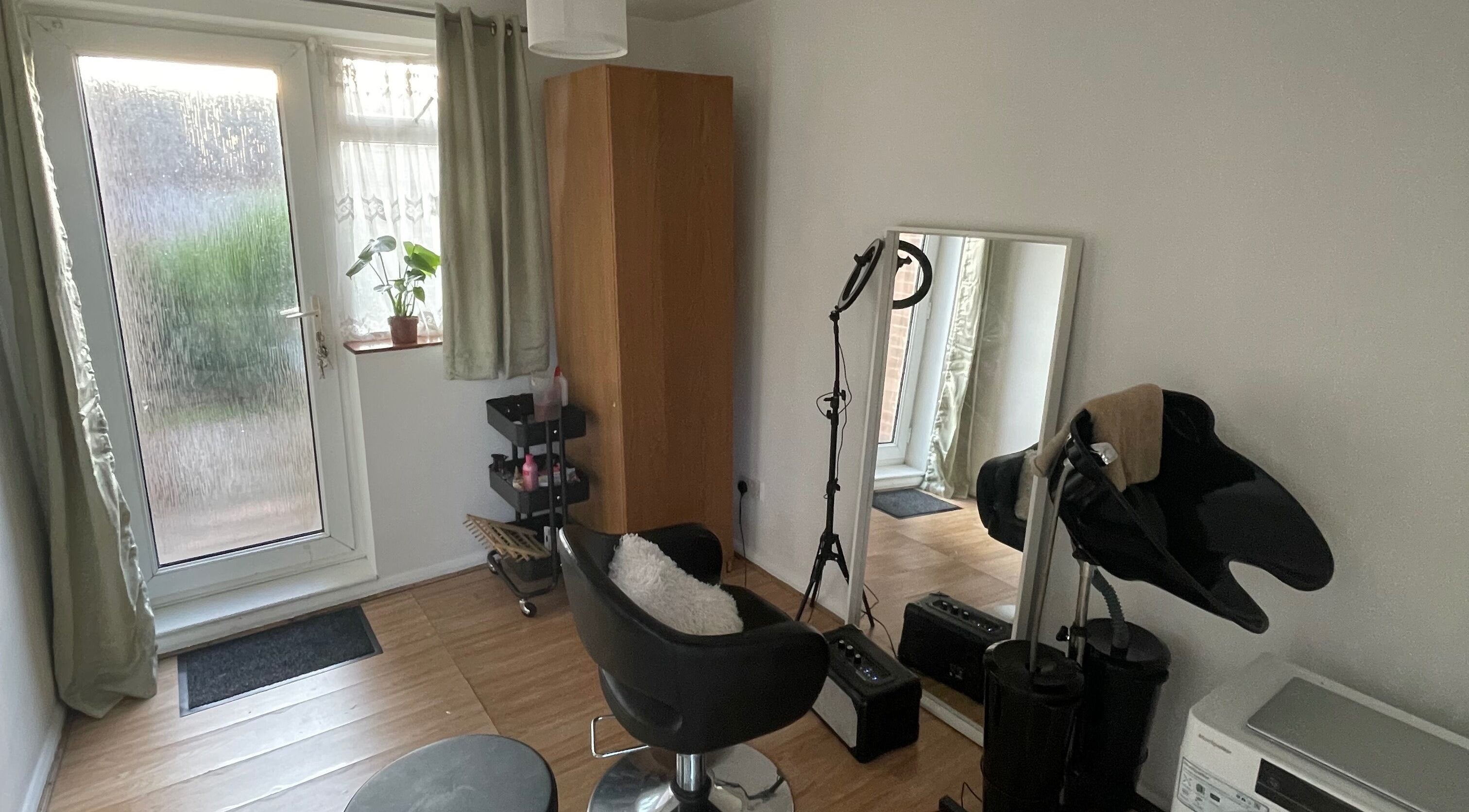 Cozy beauty workspace at Nine did Mine, London, England, GB. Features styling chair and mirror.