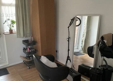 Modern salon setup at Nine did Mine in London, England, GB featuring a styling chair and large mirror.