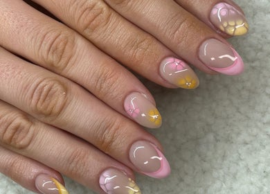 Elegant floral nail art at Raw Claws Beauty in Lismore, New South Wales, AU showcasing pink and yellow designs.