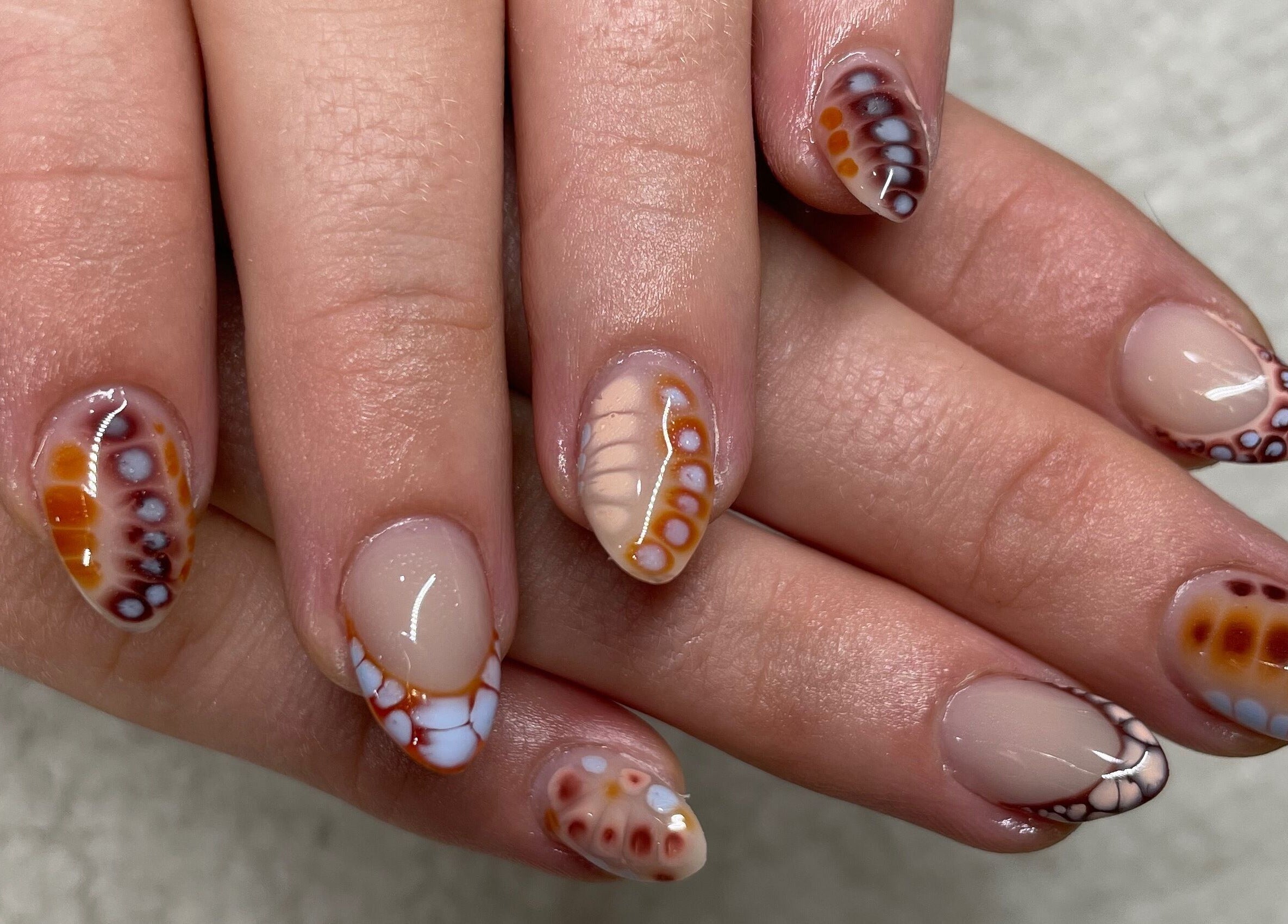 Close-up of artistic nail design at Raw Claws Beauty, Lismore, New South Wales, AU. Colorful and elegant art.