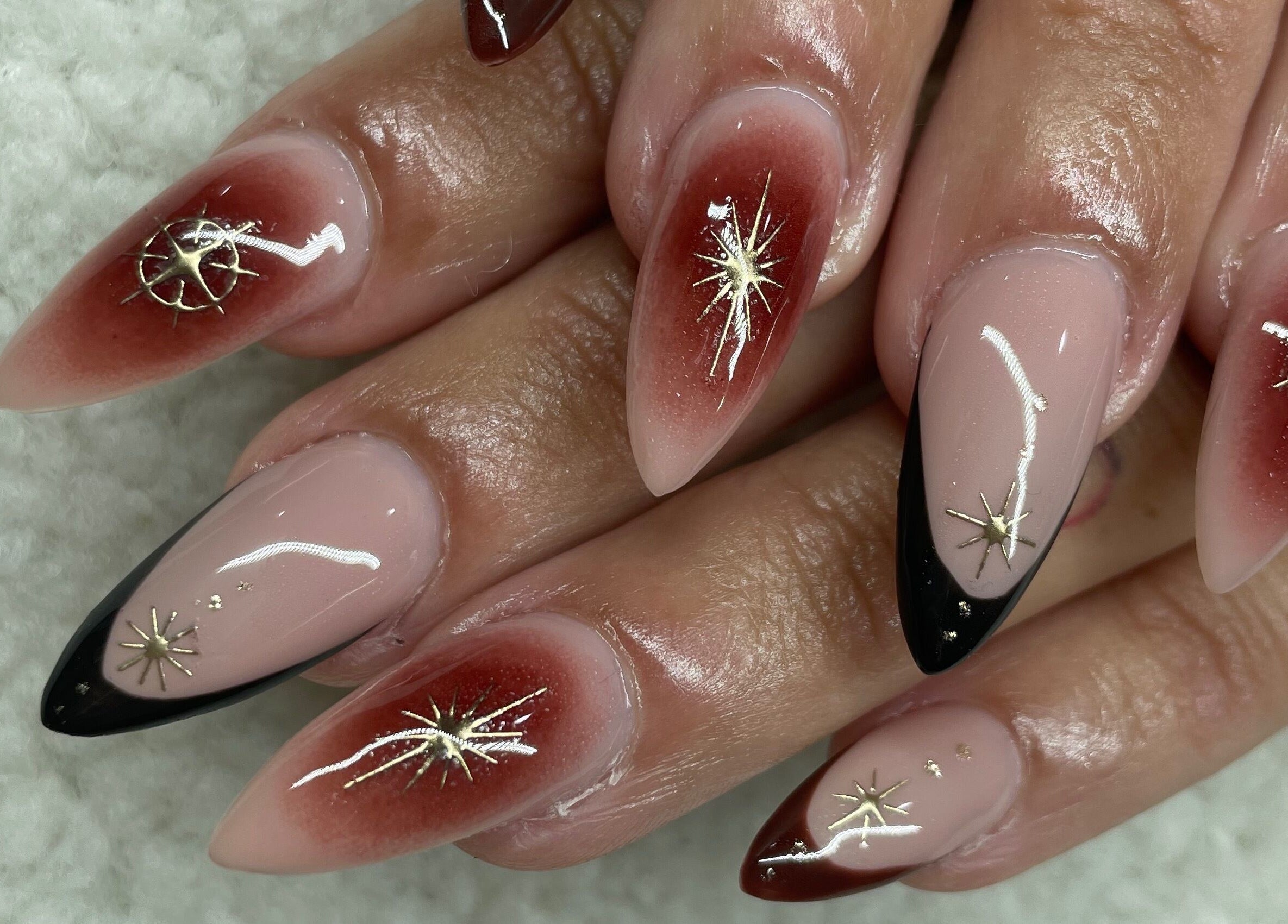 Elegant nail art with star designs at Raw Claws Beauty, Lismore, New South Wales, AU.