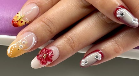 Elegant nail art at KCNailStudio in Logan Reserve, Queensland, AU, featuring intricate floral designs.