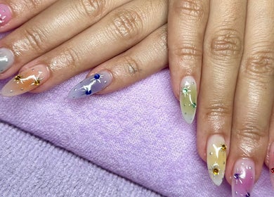 Colorful gem nail art at KCNailStudio, Logan Reserve, Queensland, AU showcasing intricate designs.
