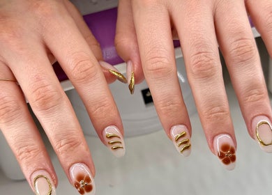 Elegant gold nail art at KCNailStudio in Logan Reserve, Queensland, AU, showcasing unique design.