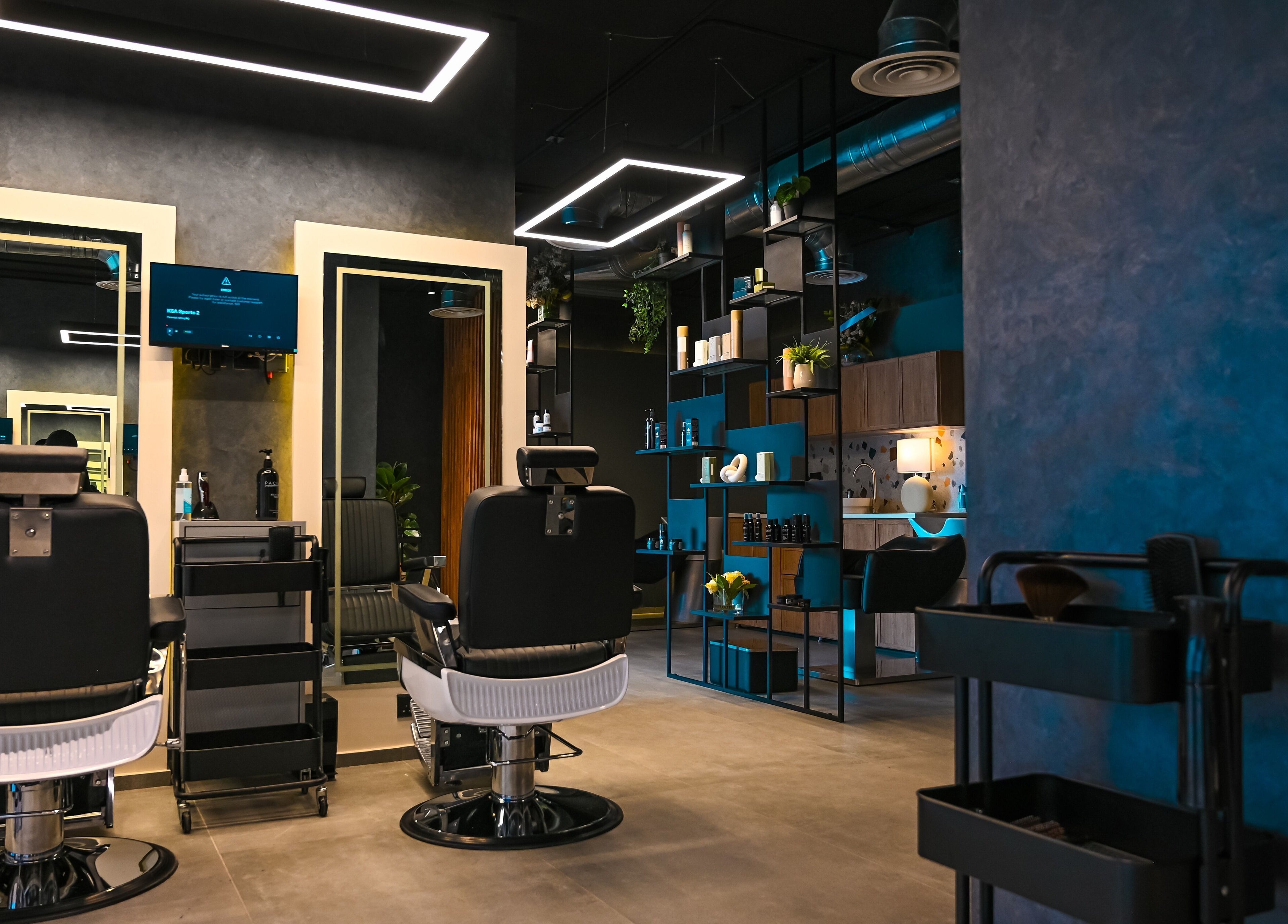 Interior of Two's Barbershop, Riyadh with stylish decor and sleek barber chairs.