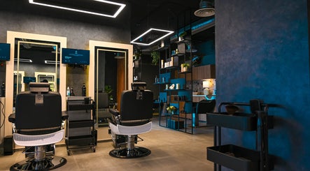 Interior of Two's Barbershop, Riyadh with stylish decor and sleek barber chairs.