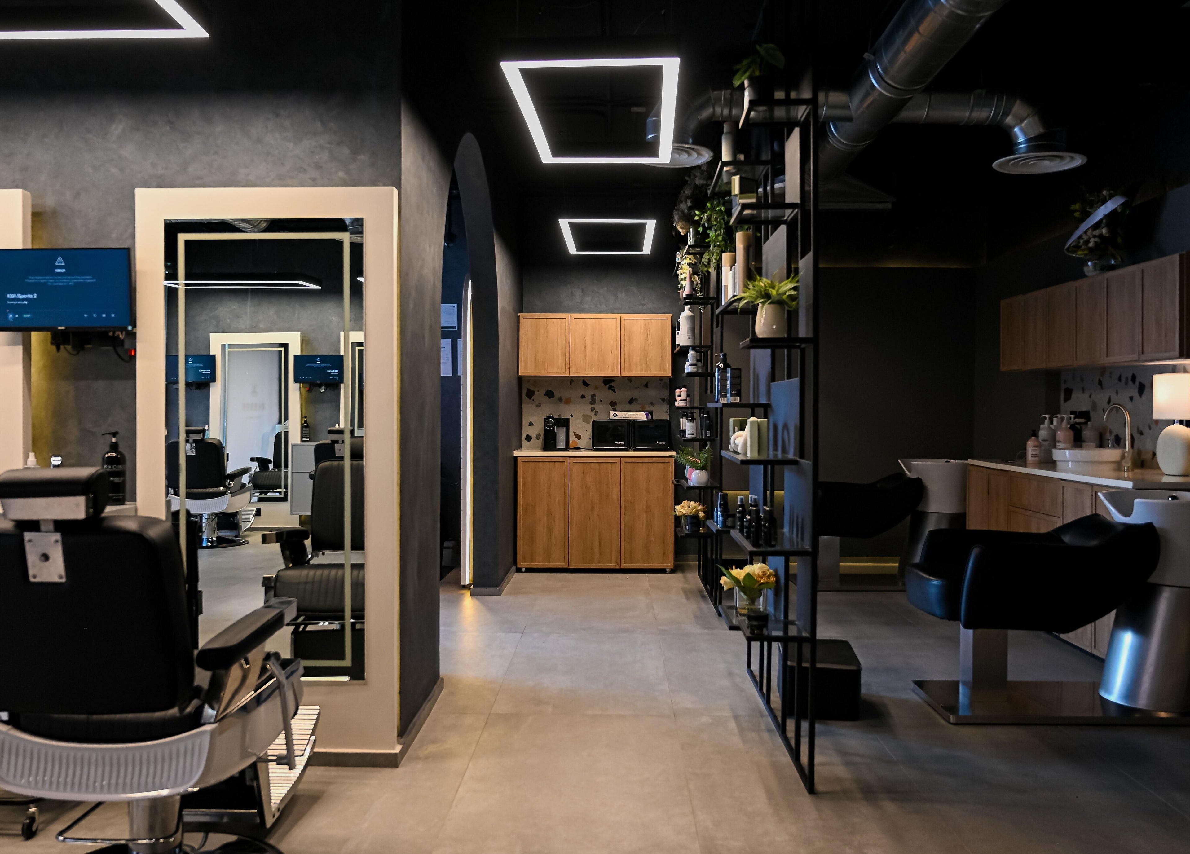Modern interior of Two's Barbershop, Riyadh, Riyadh Province, SA showcasing sleek barber chairs and stylish decor.