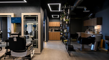 Modern interior of Two's Barbershop, Riyadh, Riyadh Province, SA showcasing sleek barber chairs and stylish decor.