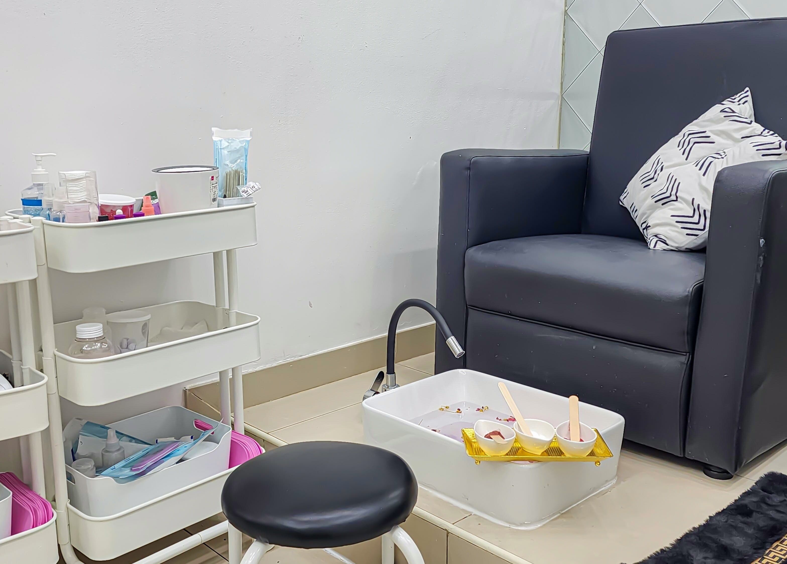 Relaxing pedicure setup at Cut and Colours Beauty Center, Abu Dhabi, Abu Dhabi, AE, featuring plush seating.